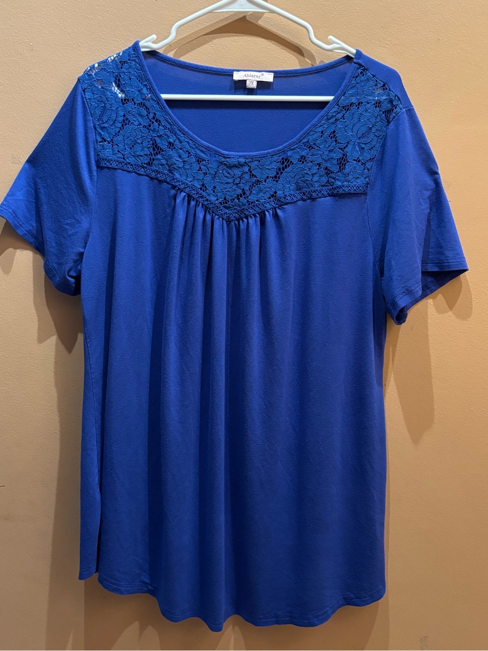 Ahlaray brand blue top features delicate lace detailing along neckline Size 2X